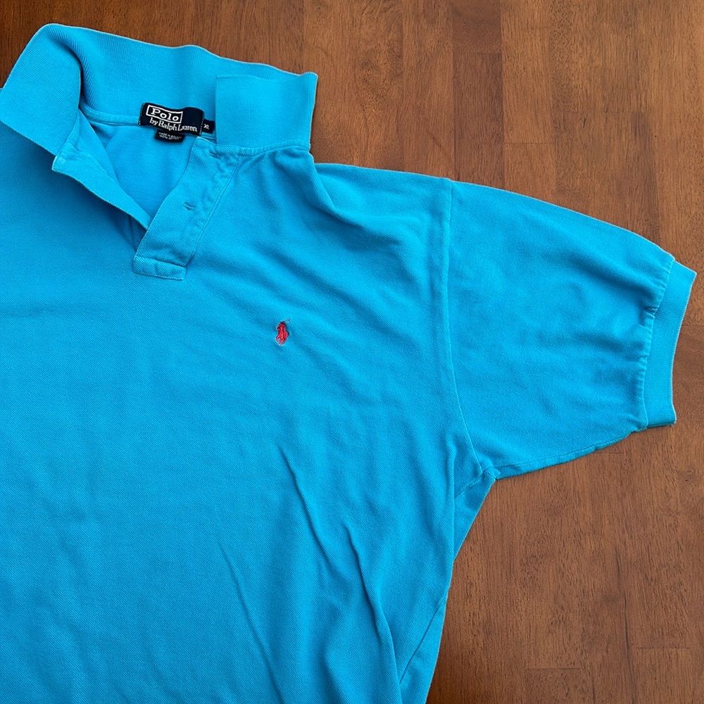 Blue, short sleeve Polo shirt with Pink symbol